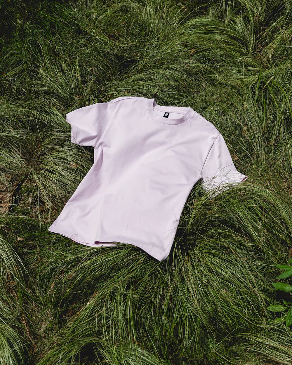 Premium tee laid on grass